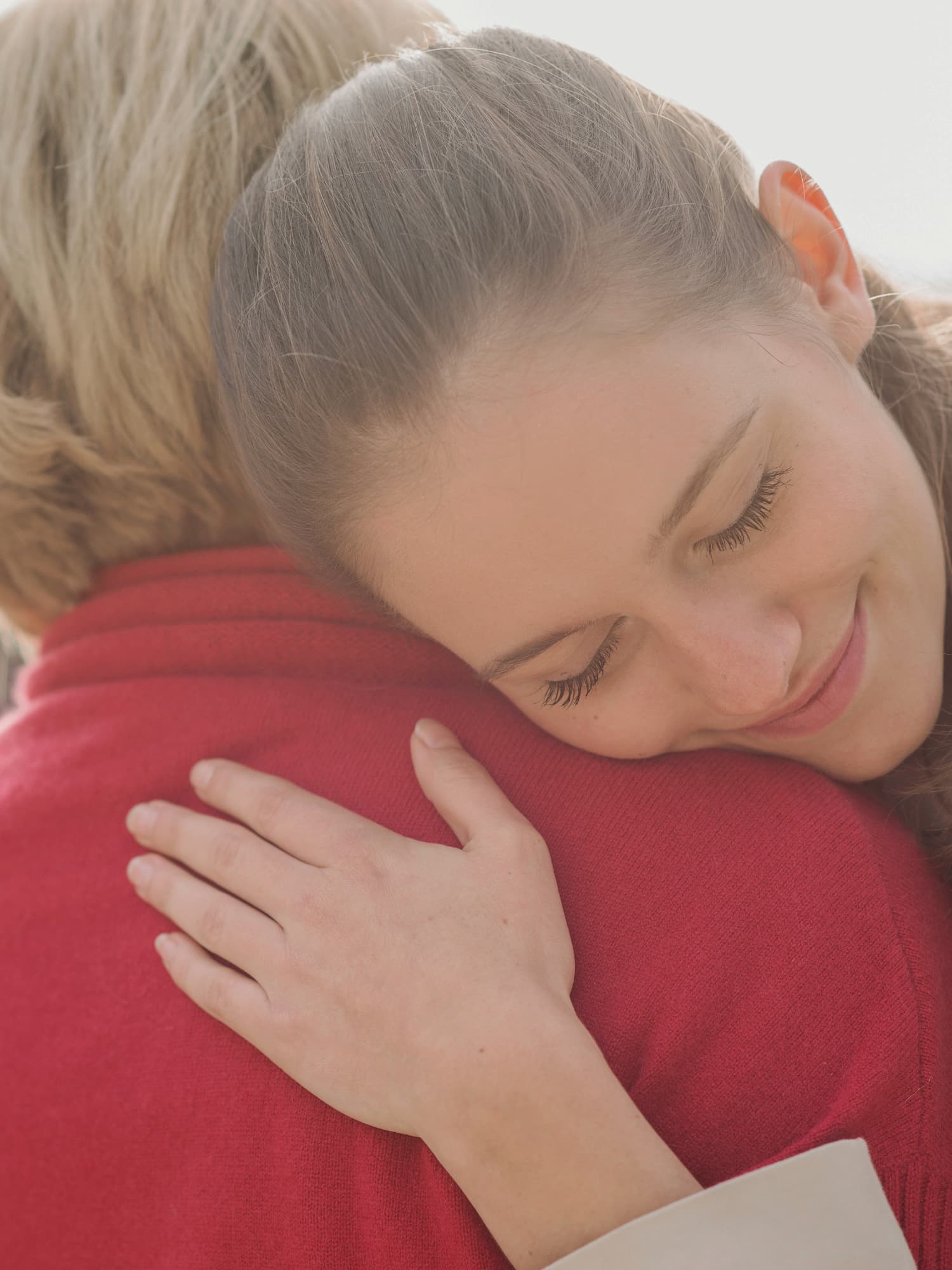 grandmother granddaughter embracing happy